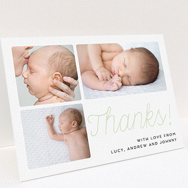 A baby card design named "Thank You Cursive". It is an A6 card in a landscape orientation. It is a photographic baby card with room for 3 photos. "Thank You Cursive" is available as a folded card, with tones of white and green.