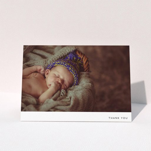 A baby card design titled "Thankful with Simplicity". It is an A5 card in a landscape orientation. It is a photographic baby card with room for 1 photo. "Thankful with Simplicity" is available as a folded card, with mainly white colouring.