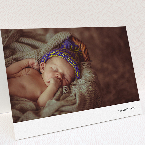 A baby card design titled "Thankful with Simplicity". It is an A5 card in a landscape orientation. It is a photographic baby card with room for 1 photo. "Thankful with Simplicity" is available as a folded card, with mainly white colouring.