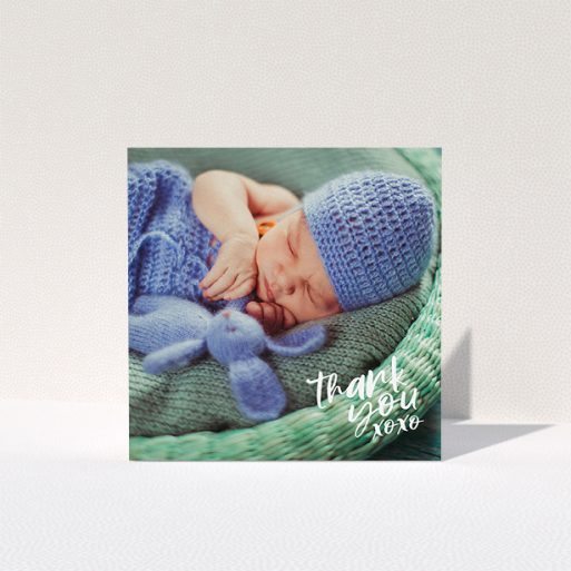 A baby card design titled "Thanks In the Corner". It is a square (148mm x 148mm) card in a square orientation. It is a photographic baby card with room for 1 photo. "Thanks In the Corner" is available as a folded card, with mainly white colouring.