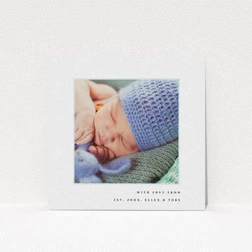 A baby card called "Thin Blue Frame". It is a square (148mm x 148mm) card in a square orientation. It is a photographic baby card with room for 1 photo. "Thin Blue Frame" is available as a flat card, with tones of white and blue.