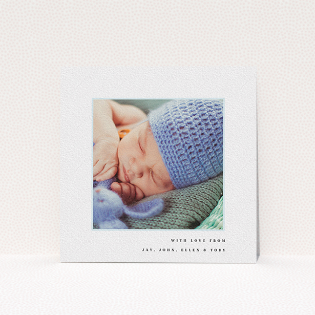 A baby card called "Thin Blue Frame". It is a square (148mm x 148mm) card in a square orientation. It is a photographic baby card with room for 1 photo. "Thin Blue Frame" is available as a flat card, with tones of white and blue.