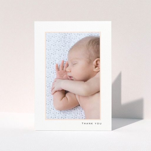 A baby card design called "Thin Pink Frame". It is an A6 card in a portrait orientation. It is a photographic baby card with room for 1 photo. "Thin Pink Frame" is available as a folded card, with tones of white and pink.