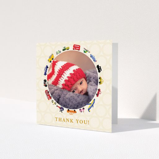 A baby card design titled 'Toy Transport'. It is a square (148mm x 148mm) card in a square orientation. It is a photographic baby card with room for 1 photo. 'Toy Transport' is available as a folded card, with tones of cream, red and yellow.