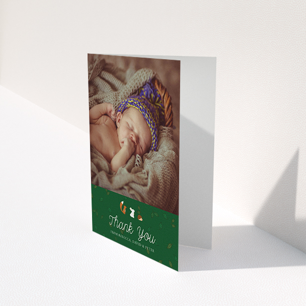 A baby card design titled "Woodland Chums". It is an A6 card in a portrait orientation. It is a photographic baby card with room for 1 photo. "Woodland Chums" is available as a folded card, with tones of green, orange and brown.