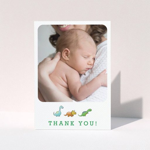 A baby thank you card design called "BabySaurus". It is an A6 card in a portrait orientation. It is a photographic baby thank you card with room for 1 photo. "BabySaurus" is available as a folded card, with tones of white, green and light blue.