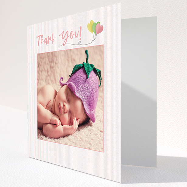 A baby thank you card design called "Balloooons". It is a square (148mm x 148mm) card in a square orientation. It is a photographic baby thank you card with room for 1 photo. "Balloooons" is available as a folded card, with mainly pink colouring.
