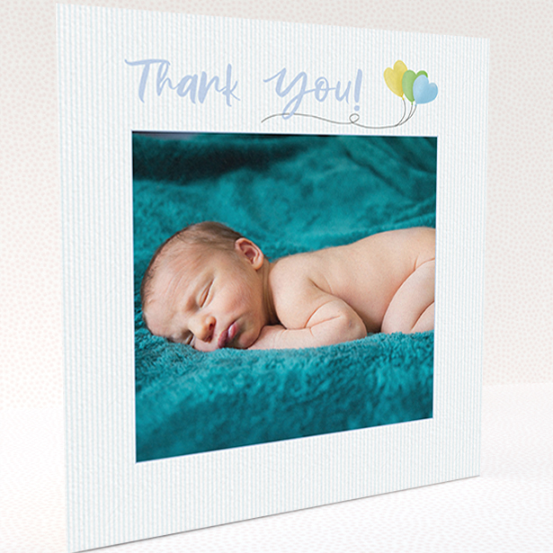 A baby thank you card design named "Balloooons". It is a square (148mm x 148mm) card in a square orientation. It is a photographic baby thank you card with room for 1 photo. "Balloooons" is available as a folded card, with mainly blue colouring.