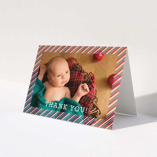 A baby thank you card called 'Blue, Red and White Slant'. It is an A6 card in a landscape orientation. It is a photographic baby thank you card with room for 1 photo. 'Blue, Red and White Slant' is available as a folded card, with mainly red colouring.