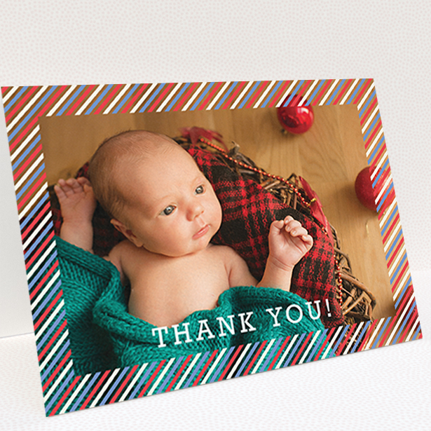A baby thank you card called "Blue, Red and White Slant". It is an A6 card in a landscape orientation. It is a photographic baby thank you card with room for 1 photo. "Blue, Red and White Slant" is available as a folded card, with mainly red colouring.