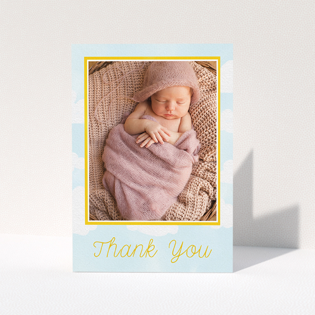 A baby thank you card design titled "Blue Skies". It is an A5 card in a portrait orientation. It is a photographic baby thank you card with room for 1 photo. "Blue Skies" is available as a folded card, with tones of blue and yellow.