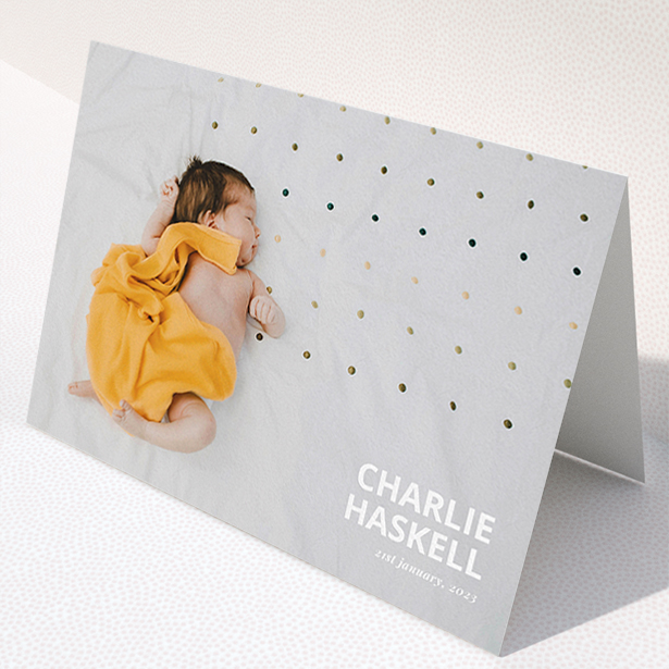 A baby thank you card named "Bold Photo Corner". It is an A5 card in a landscape orientation. It is a photographic baby thank you card with room for 1 photo. "Bold Photo Corner" is available as a folded card, with mainly white colouring.