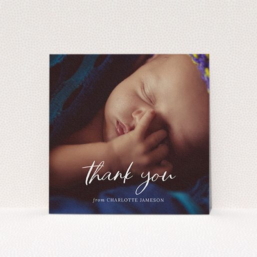 A baby thank you card design titled "Calligraphy Thanks". It is a square (148mm x 148mm) card in a square orientation. It is a photographic baby thank you card with room for 1 photo. "Calligraphy Thanks" is available as a flat card, with mainly white colouring.