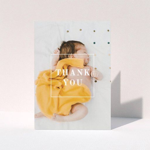 A baby thank you card called "Central Thanks". It is an A5 card in a portrait orientation. It is a photographic baby thank you card with room for 1 photo. "Central Thanks" is available as a folded card, with mainly white colouring.