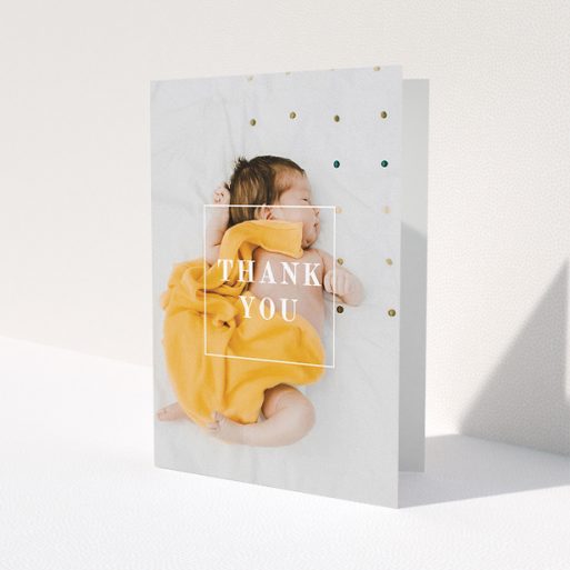 A baby thank you card called 'Central Thanks'. It is an A5 card in a portrait orientation. It is a photographic baby thank you card with room for 1 photo. 'Central Thanks' is available as a folded card, with mainly white colouring.