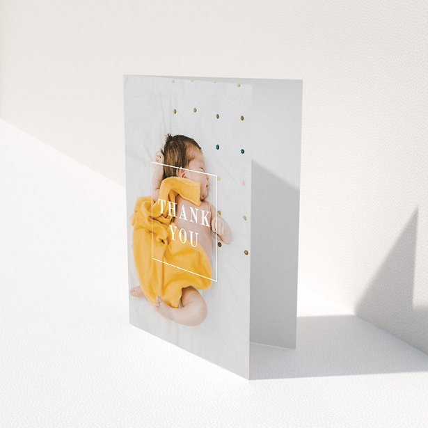 A baby thank you card called "Central Thanks". It is an A5 card in a portrait orientation. It is a photographic baby thank you card with room for 1 photo. "Central Thanks" is available as a folded card, with mainly white colouring.