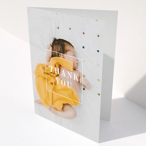 A baby thank you card called "Central Thanks". It is an A5 card in a portrait orientation. It is a photographic baby thank you card with room for 1 photo. "Central Thanks" is available as a folded card, with mainly white colouring.