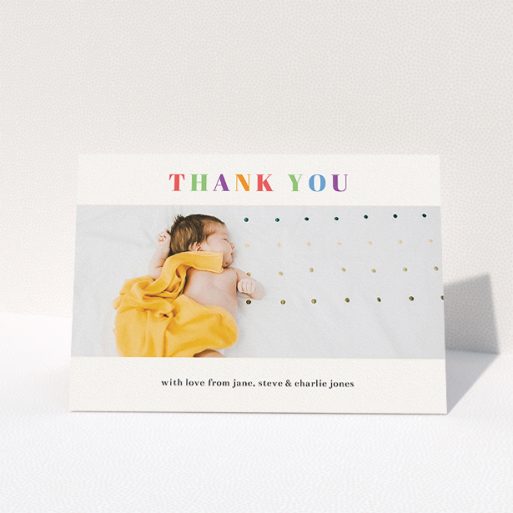 A baby thank you card design called "Colourful Thanks". It is an A5 card in a landscape orientation. It is a photographic baby thank you card with room for 1 photo. "Colourful Thanks" is available as a folded card, with tones of white and green.