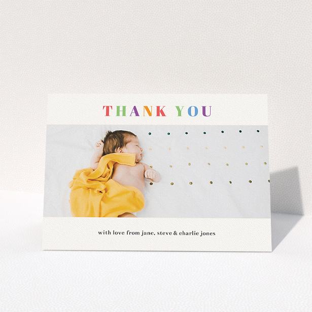 A baby thank you card design called "Colourful Thanks". It is an A5 card in a landscape orientation. It is a photographic baby thank you card with room for 1 photo. "Colourful Thanks" is available as a folded card, with tones of white and green.