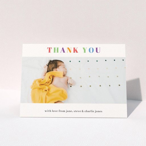 A baby thank you card named "Colourful Thanks". It is an A6 card in a landscape orientation. It is a photographic baby thank you card with room for 1 photo. "Colourful Thanks" is available as a folded card, with tones of white and green.