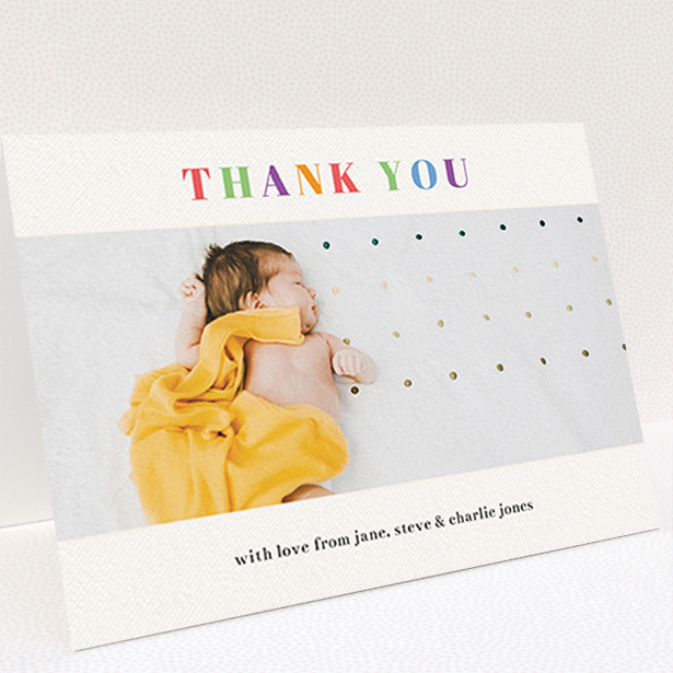 A baby thank you card named "Colourful Thanks". It is an A6 card in a landscape orientation. It is a photographic baby thank you card with room for 1 photo. "Colourful Thanks" is available as a folded card, with tones of white and green.