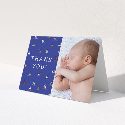 A baby thank you card template titled 'Cowes Week'. It is an A5 card in a landscape orientation. It is a photographic baby thank you card with room for 1 photo. 'Cowes Week' is available as a folded card, with mainly blue colouring.