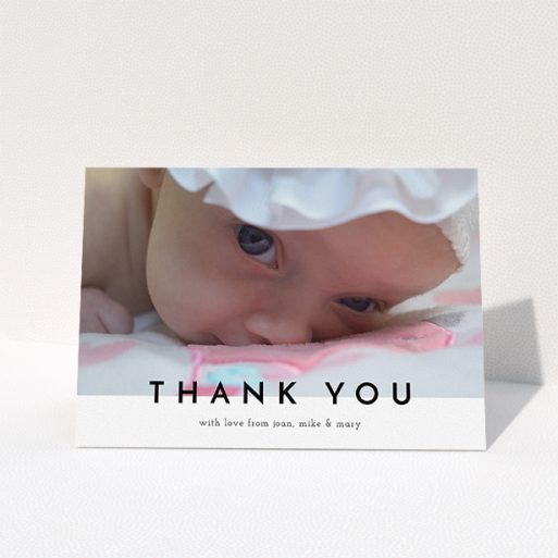 A baby thank you card design called "Cross Border". It is an A5 card in a landscape orientation. It is a photographic baby thank you card with room for 1 photo. "Cross Border" is available as a folded card, with mainly white colouring.