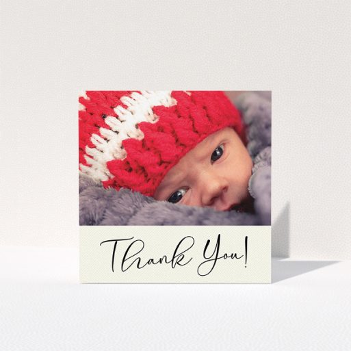 A baby thank you card template titled "Cursive Thanks". It is a square (148mm x 148mm) card in a square orientation. It is a photographic baby thank you card with room for 1 photo. "Cursive Thanks" is available as a folded card, with mainly cream colouring.