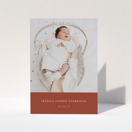 A baby thank you card called "Dark Ochre Footer". It is an A5 card in a portrait orientation. It is a photographic baby thank you card with room for 1 photo. "Dark Ochre Footer" is available as a folded card, with mainly dark orange colouring.