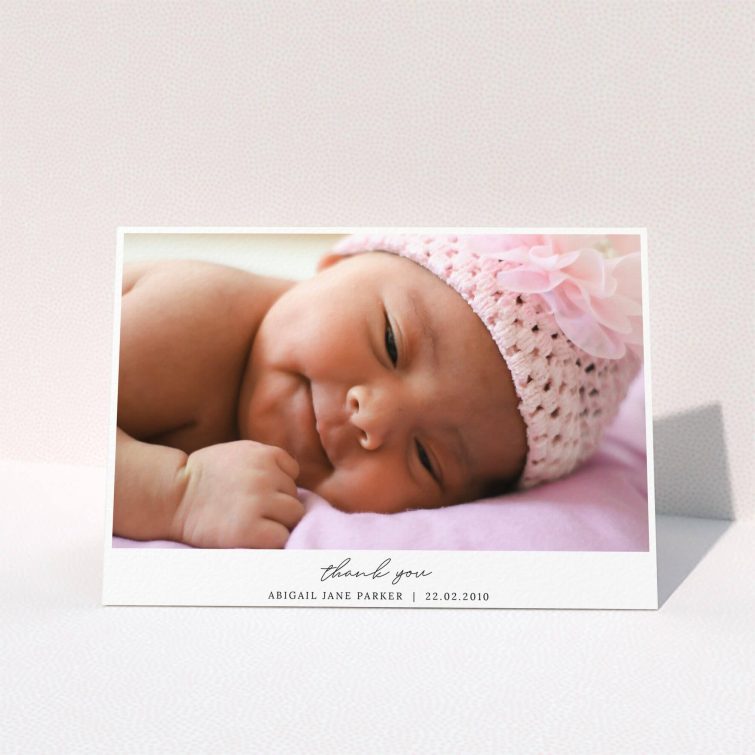 A baby thank you card design named "Everything You Need". It is an A5 card in a landscape orientation. It is a photographic baby thank you card with room for 1 photo. "Everything You Need" is available as a folded card, with mainly white colouring.