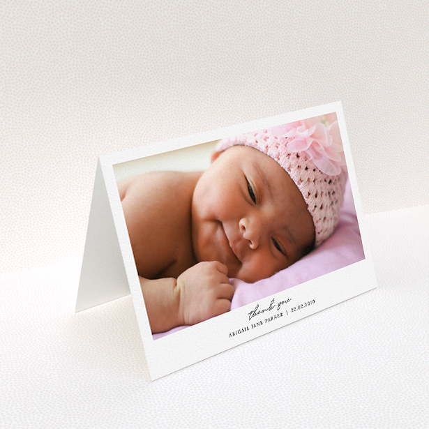 A baby thank you card design named "Everything You Need". It is an A5 card in a landscape orientation. It is a photographic baby thank you card with room for 1 photo. "Everything You Need" is available as a folded card, with mainly white colouring.
