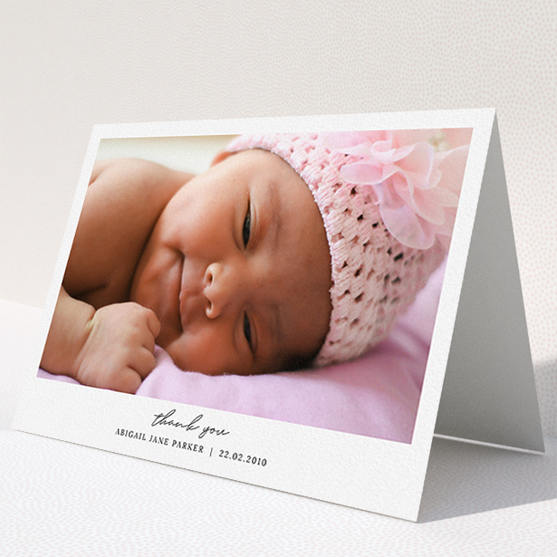 A baby thank you card design named "Everything You Need". It is an A5 card in a landscape orientation. It is a photographic baby thank you card with room for 1 photo. "Everything You Need" is available as a folded card, with mainly white colouring.