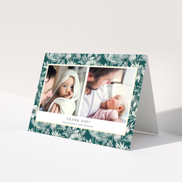 Baby thank you card with floral border and two photos of a baby with a parent.