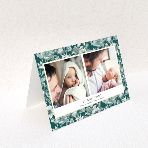 Baby thank you card with floral border and two photos of a baby with a parent.