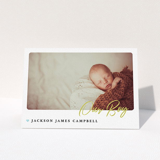 A baby thank you card called "Gold Stamp". It is an A6 card in a landscape orientation. It is a photographic baby thank you card with room for 1 photo. "Gold Stamp" is available as a folded card, with tones of white and blue.