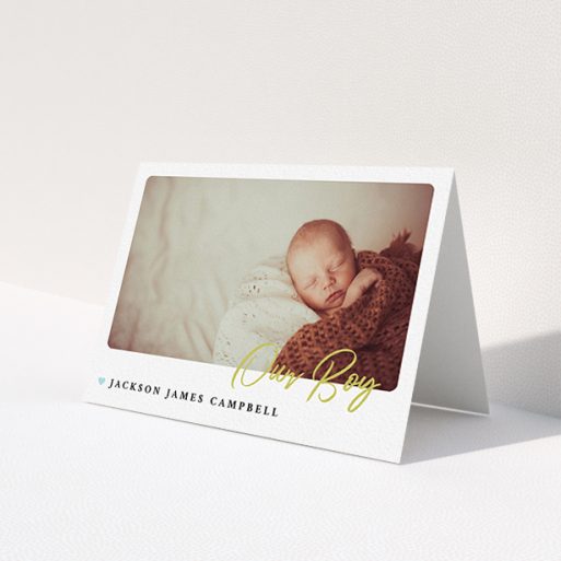 A baby thank you card called 'Gold Stamp'. It is an A6 card in a landscape orientation. It is a photographic baby thank you card with room for 1 photo. 'Gold Stamp' is available as a folded card, with tones of white and blue.