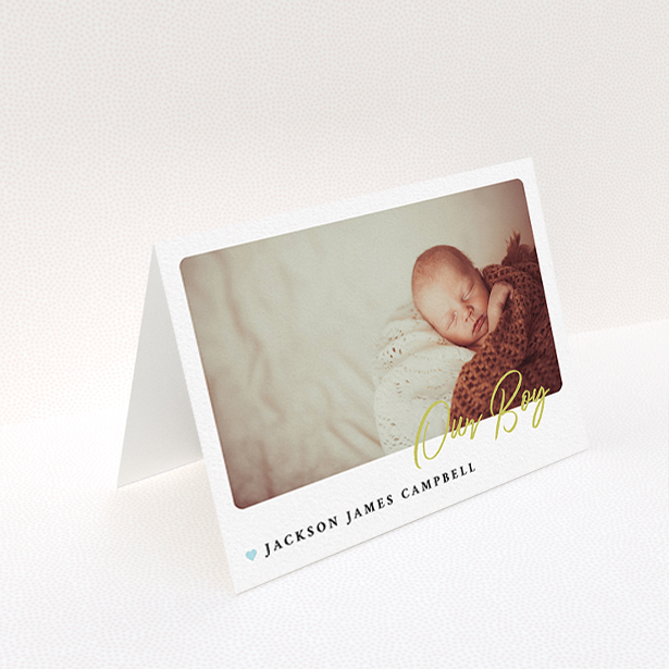 A baby thank you card called "Gold Stamp". It is an A6 card in a landscape orientation. It is a photographic baby thank you card with room for 1 photo. "Gold Stamp" is available as a folded card, with tones of white and blue.