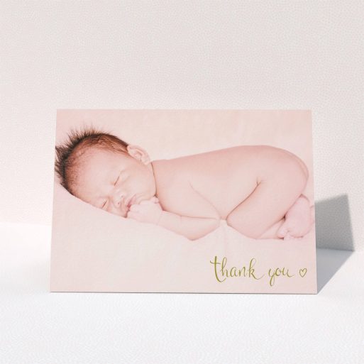 A baby thank you card template titled "Gold Thanks". It is an A5 card in a landscape orientation. It is a photographic baby thank you card with room for 1 photo. "Gold Thanks" is available as a folded card, with mainly gold colouring.