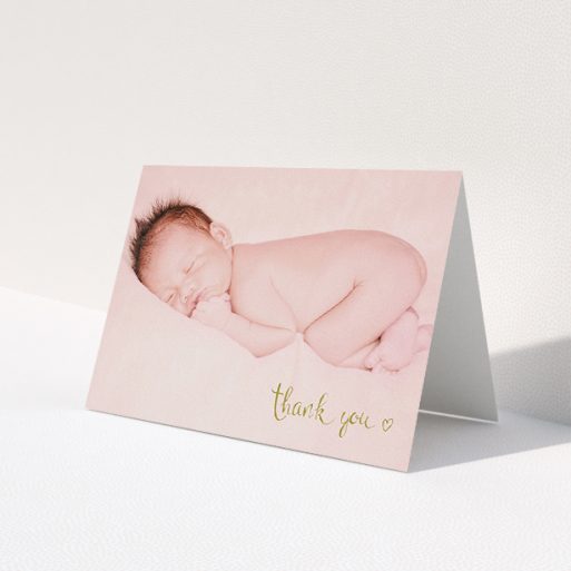A baby thank you card template titled 'Gold Thanks'. It is an A5 card in a landscape orientation. It is a photographic baby thank you card with room for 1 photo. 'Gold Thanks' is available as a folded card, with mainly gold colouring.