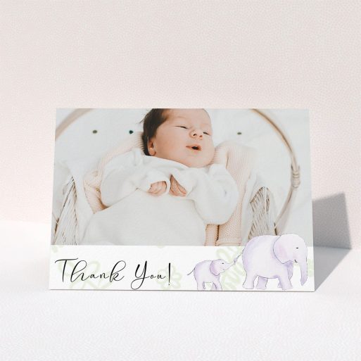 A baby thank you card template titled "Gotcha by the Tail". It is an A6 card in a landscape orientation. It is a photographic baby thank you card with room for 1 photo. "Gotcha by the Tail" is available as a folded card, with tones of purple and green.