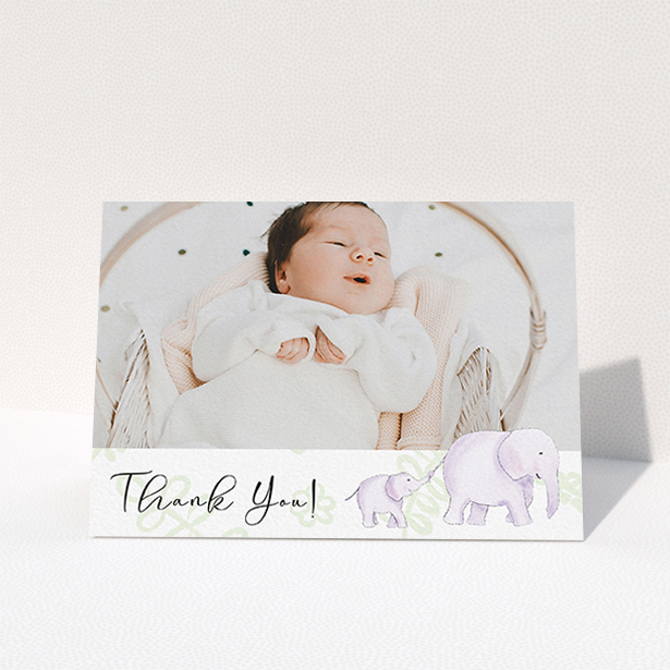 A baby thank you card template titled "Gotcha by the Tail". It is an A6 card in a landscape orientation. It is a photographic baby thank you card with room for 1 photo. "Gotcha by the Tail" is available as a folded card, with tones of purple and green.