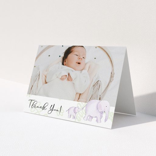 A baby thank you card template titled 'Gotcha by the Tail'. It is an A6 card in a landscape orientation. It is a photographic baby thank you card with room for 1 photo. 'Gotcha by the Tail' is available as a folded card, with tones of purple and green.