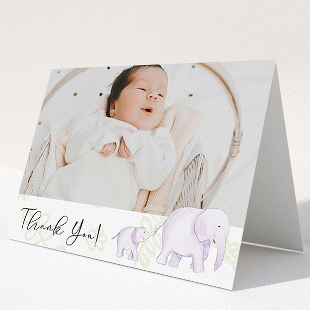 A baby thank you card template titled "Gotcha by the Tail". It is an A6 card in a landscape orientation. It is a photographic baby thank you card with room for 1 photo. "Gotcha by the Tail" is available as a folded card, with tones of purple and green.