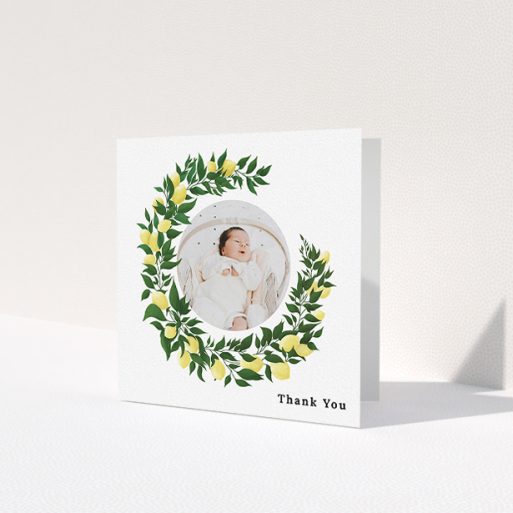 A baby thank you card design named 'Lemon Wreath'. It is a square (148mm x 148mm) card in a square orientation. It is a photographic baby thank you card with room for 1 photo. 'Lemon Wreath' is available as a folded card, with tones of green and yellow.