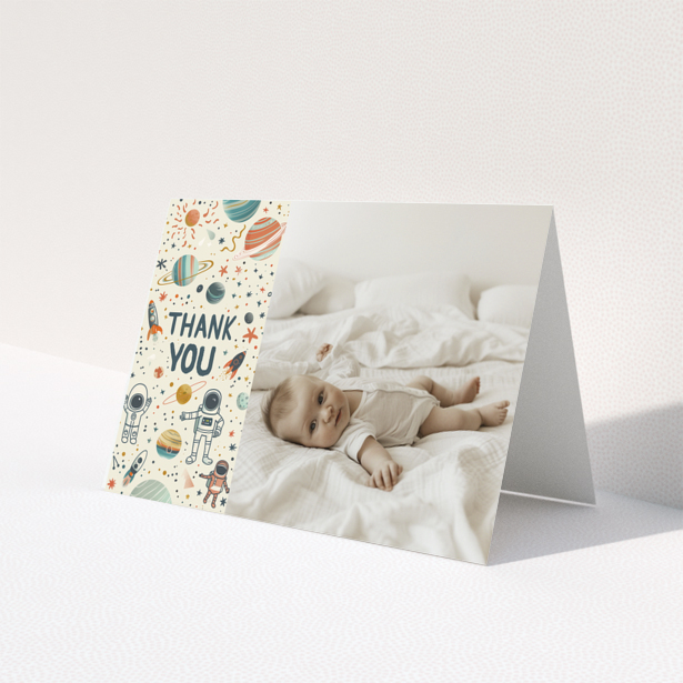 Baby thank you card with space-themed design and one photo of a baby laying on a bed