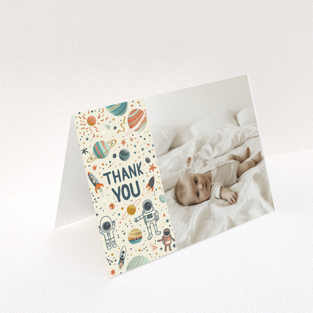 Baby thank you card with space-themed design and one photo of a baby laying on a bed