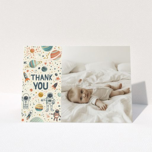 Baby thank you card with space-themed design and one photo of a baby laying on a bed