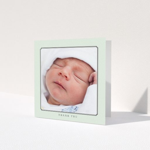 A baby thank you card called 'Mint Deco'. It is a square (148mm x 148mm) card in a square orientation. It is a photographic baby thank you card with room for 1 photo. 'Mint Deco' is available as a folded card, with mainly green colouring.