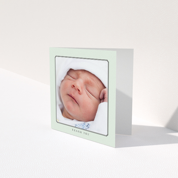 A baby thank you card called "Mint Deco". It is a square (148mm x 148mm) card in a square orientation. It is a photographic baby thank you card with room for 1 photo. "Mint Deco" is available as a folded card, with mainly green colouring.