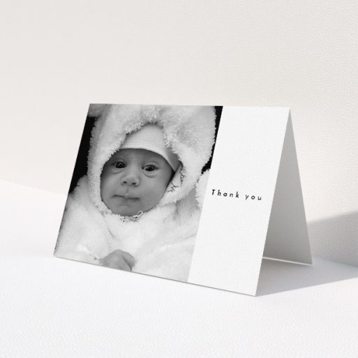 A baby thank you card design called 'Most of the Page Frame'. It is an A5 card in a landscape orientation. It is a photographic baby thank you card with room for 1 photo. 'Most of the Page Frame' is available as a folded card, with mainly white colouring.